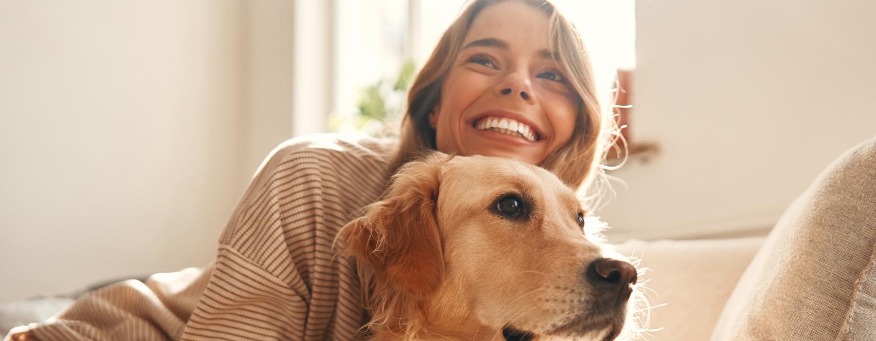 a girl holding her dog